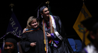  Student at graduation with school principal.