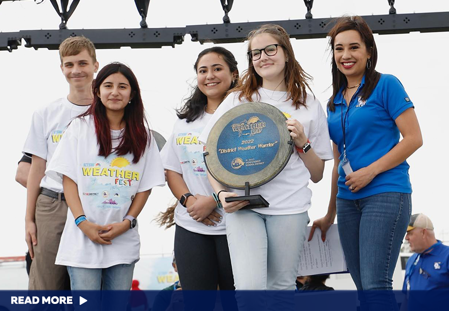  students with trophy