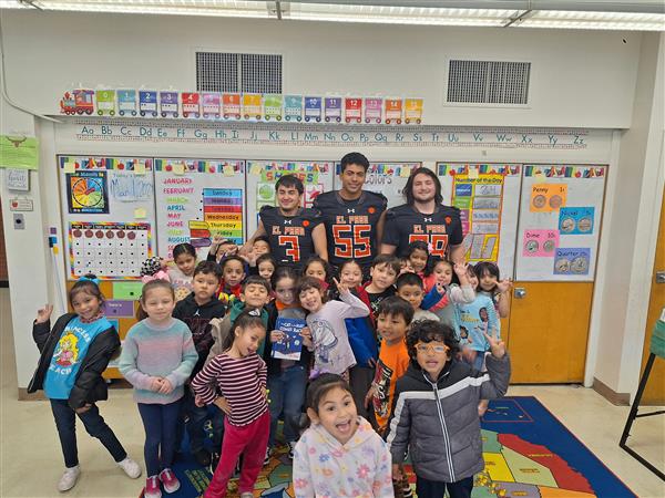 ELP High School team reading to Lamar Elementary Students