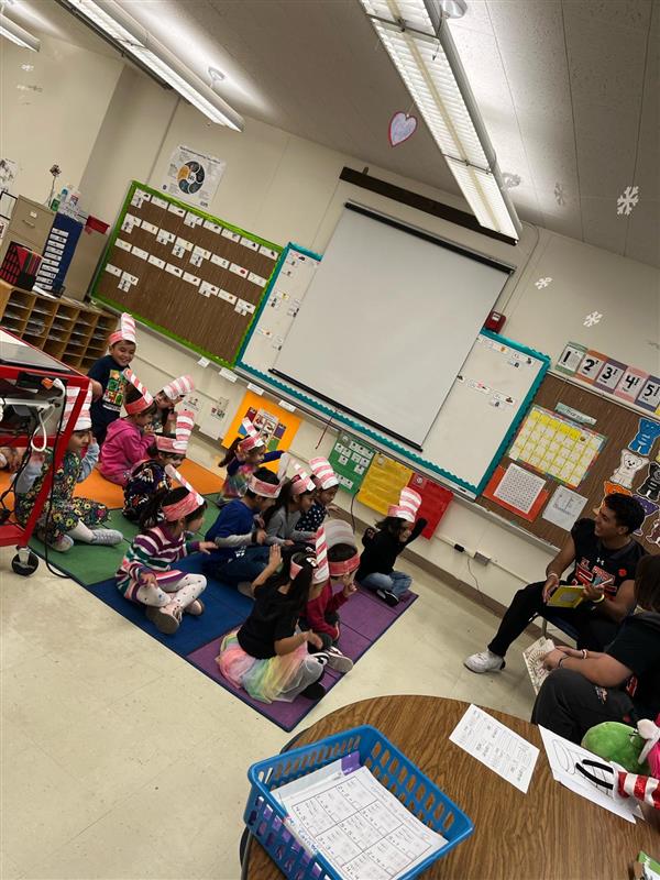 ELP High School team reading to Lamar Elementary Students