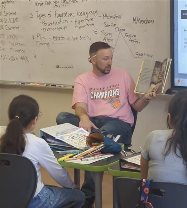 ELP High School team reading to Lamar Elementary Students