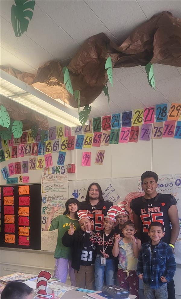 ELP High School team reading to Lamar Elementary Students