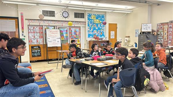 ELP High School team reading to Lamar Elementary Students