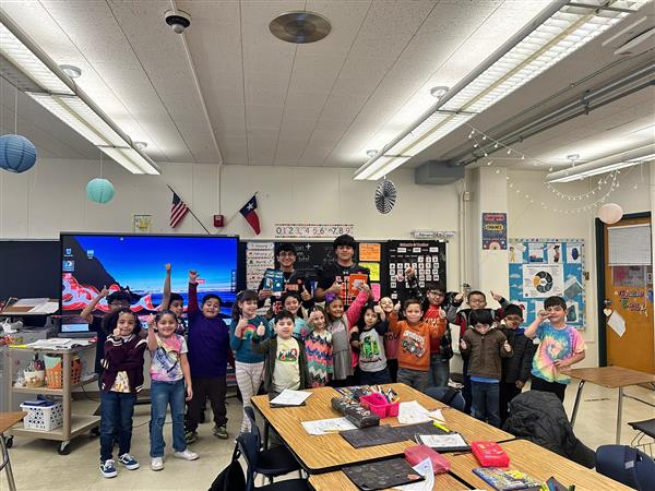 ELP High School team reading to Lamar Elementary Students